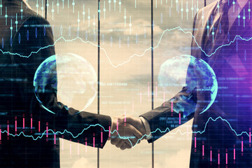 Double exposure of forex graph hologram and handshake of two men. Stock market concept.