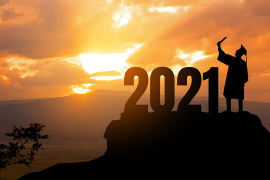 Silhouette Young man Graduation in 2021 years, education congratulation concept ,Freedom and Happy new year, copy space.