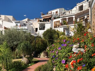 Spanish white town with colorful flowers