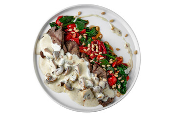Beef stroganoff slices of steak in mushroom cream sauce with cooked spinach and baked bell peppers.