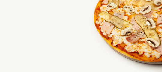 Delicious Meat pizza served on a wooden plate, ingredients Signature sauce, mozzarella cheese, ham, bacon, pickled cucumber, mushrooms on white. Pizzeria promotion poster.