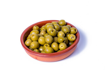 Olives stuffed with anchovies in a ceramic bowl and white background