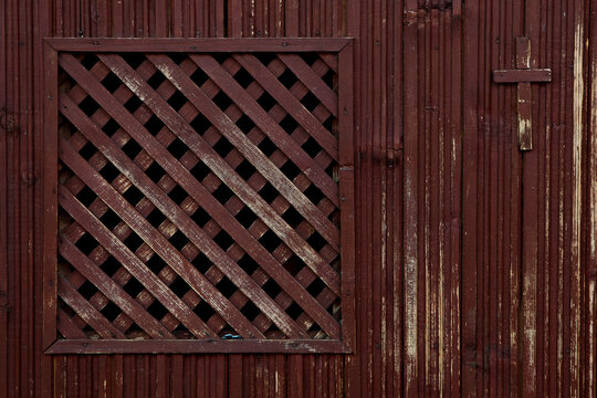 A Catholic wooden confession booth, empty, in close range, old one. Religion concept