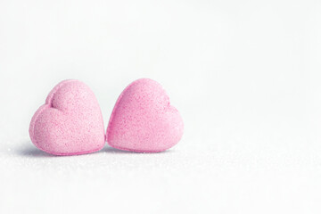 Pink heardts  on white glitter   background  . Valentines day concept  .