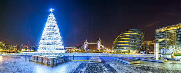 More london riverside panorama at night during christmas season. England