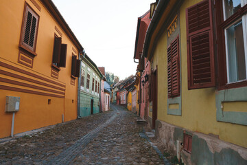 empty street with colorful houses