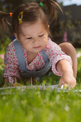 Two little girls sisters paint with finger paints