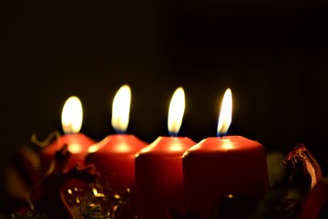 Obraz na płótnie Canvas close up of an Advent arrangement with four burning candles