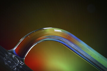 Selective focus shot of a handle of a carafe with colorful lights