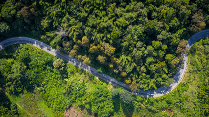 Fototapeta premium aerial view mountain paths rural road between the city