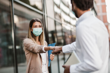 Business people shake hand no touch concept new normal social distancing,outdoor