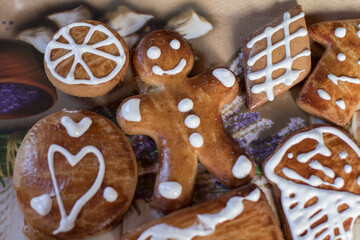 Home-made gingerbread cookies on plastic plate, top view