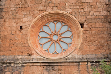 Beautiful circular window of the Church of San Miguel Arcangel in Ibdes, Spain