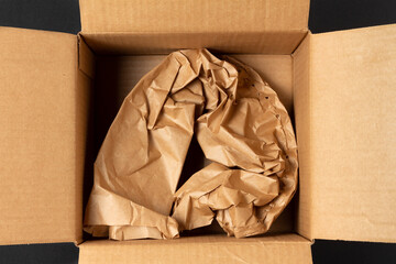 Crumpled wrapping paper in cardboard box