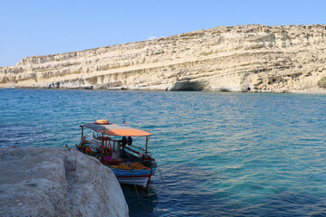 Traditional boat in the port of Matala in Crete, Greece