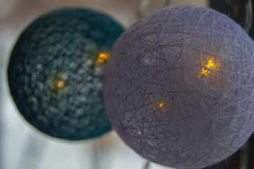 Christmas toys with lanterns hanging on the cold window