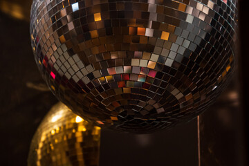 Mirror disco ball holiday decoration. Glow and reflection. Retro festive background. Nightlife concept. Selective focus.