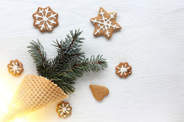 waffle cone with spruce branches and shaped cookies. fireworks winter emotions