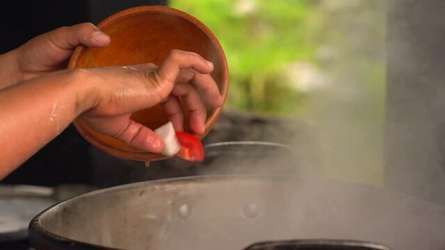 Making  stew in boiling pot.
