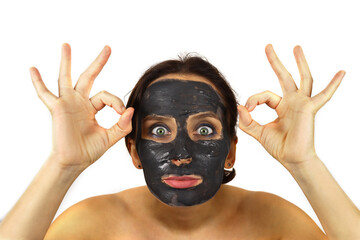 woman removes a cosmetic mask from her face. Skin care, Spa treatments