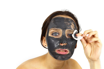 woman removes a cosmetic mask from her face. Skin care, Spa treatments