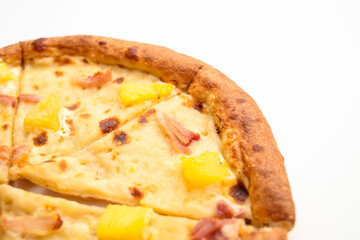Hawaiian pizza with ham, cheese and pineapple isolated on white background