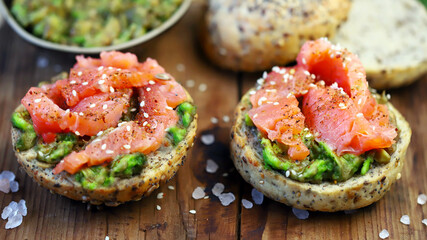 Salmon avocado sandwiches on healthy seed buns. Healthy snack. The keto diet.