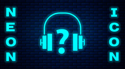 Glowing neon Headphones icon isolated on brick wall background. Support customer service, hotline, call center, faq, maintenance.  Vector Illustration