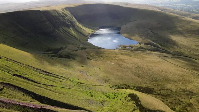 Llyn y fan Fach Brecon beacons perfection Wales mountain valley countryside lake wilderness Aerial wide orbit right