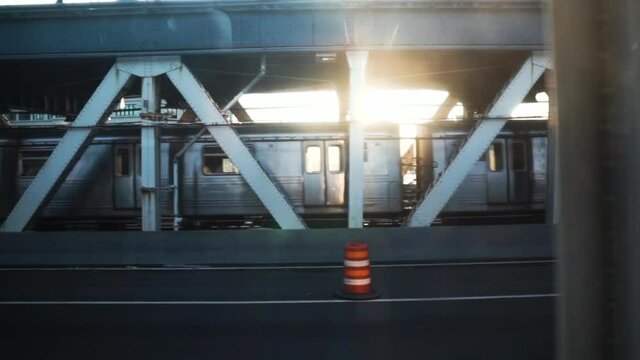Train subway passing next to another train at dusk - Slow motion
