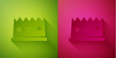 Paper cut King crown icon isolated on green and pink background. Paper art style. Vector.