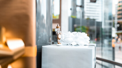 Nutcracker standing on stack of presents