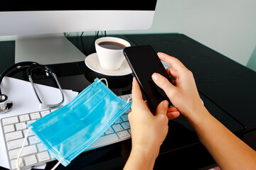 disinfection of a computer keyboard with an antiseptic. Disinfecting workplace concept.