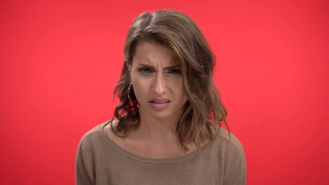 Beautiful woman shakes head no in slow motion