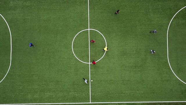 Aerial Top Down View of Soccer Field and Two Teams Playing. Kick off Start of the Energetic Match on International Championship. Energetic Game in the Middle of the Field. Important Match on