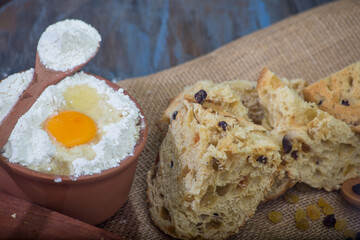 panettone and chocotone on rustic table. ingredients on the table