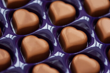 Close-up chocolates hearts on box. Top view. Valentines day celebration concept