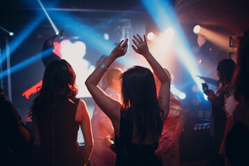 Silhouettes of a crowd on show in night club celebration