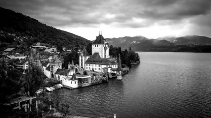 Fototapeta na wymiar Famous Castle Oberhofen at Lake Thun in Switzerland - drone footage