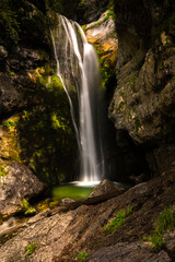 Fototapeta na wymiar Slap Mostnice, also called Slap Voje or Slap Šum, is one of the many waterfalls in Korita Mostnice (Korita gorge) near lake Bohinj, at Stara Fuzina, Triglav National Park, Slovenia.