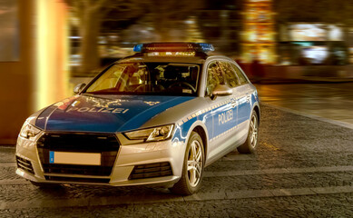 Police car in a pedestrian zone to check passers-by due to the Corona pandemic © EKH-Pictures
