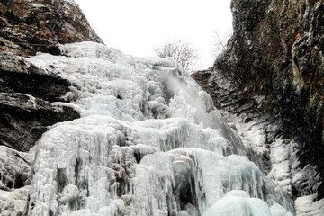 Fototapeta na wymiar The frozen Gveleti waterfall. Georgia