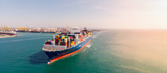 Aerial side view of cargo ship carrying container and running, webinar banner forward mast