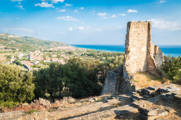 Fototapeta na wymiar The City of Ascea, in Cilento, Campania Italy, on Cloudy Sky Background with the Tyrrhenian Sea and the Normans Tower of Velia (Torre di Velia)