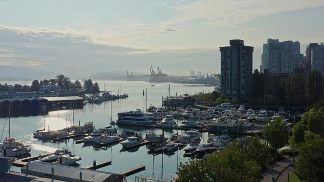 Drone Aerial Shot Over the Vancouver Marina, Sliding Closer to the Cityscape Skyscrapers Canada.