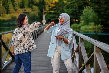 Female friends using elbow greeting