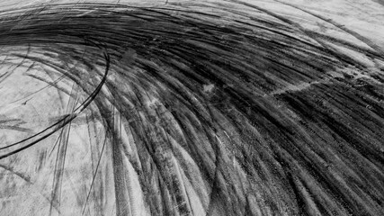 Abstract texture and background of car tire drift skid mark on road race track, Black tire mark on...