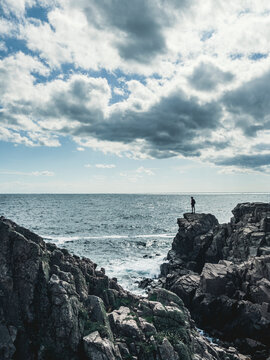 View of rocky coast at sea
