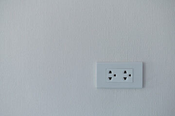 Hole for plugging in the white wall