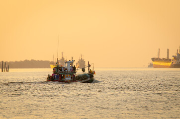 fisherman's boat is sailing to the Gulf of Thailand to fish.